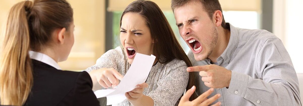 Angry siblings infront of attorney holding property document