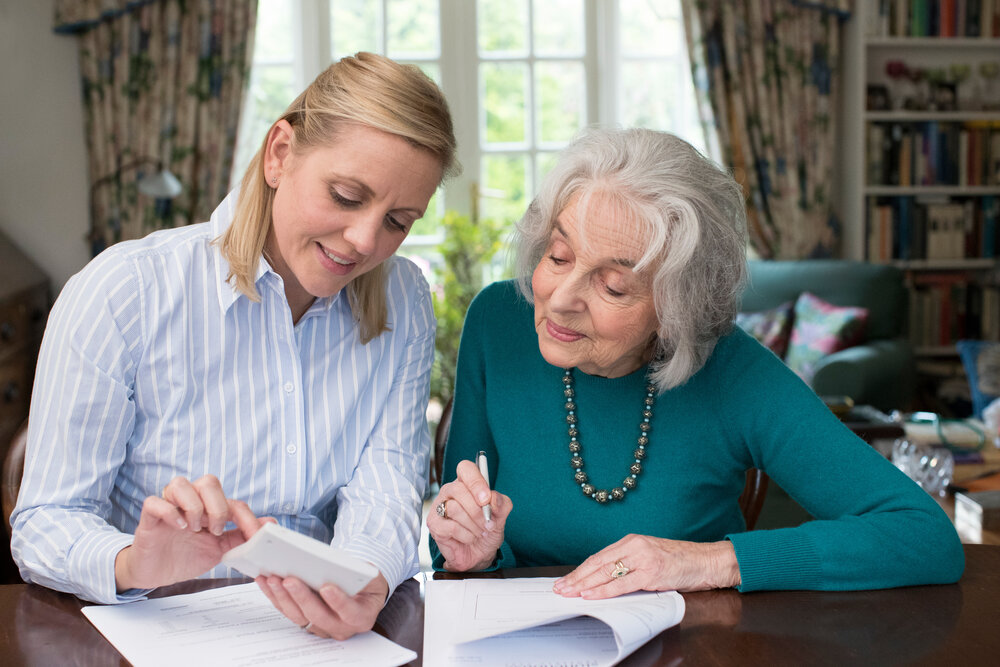 A family signing trust documents with their attorney